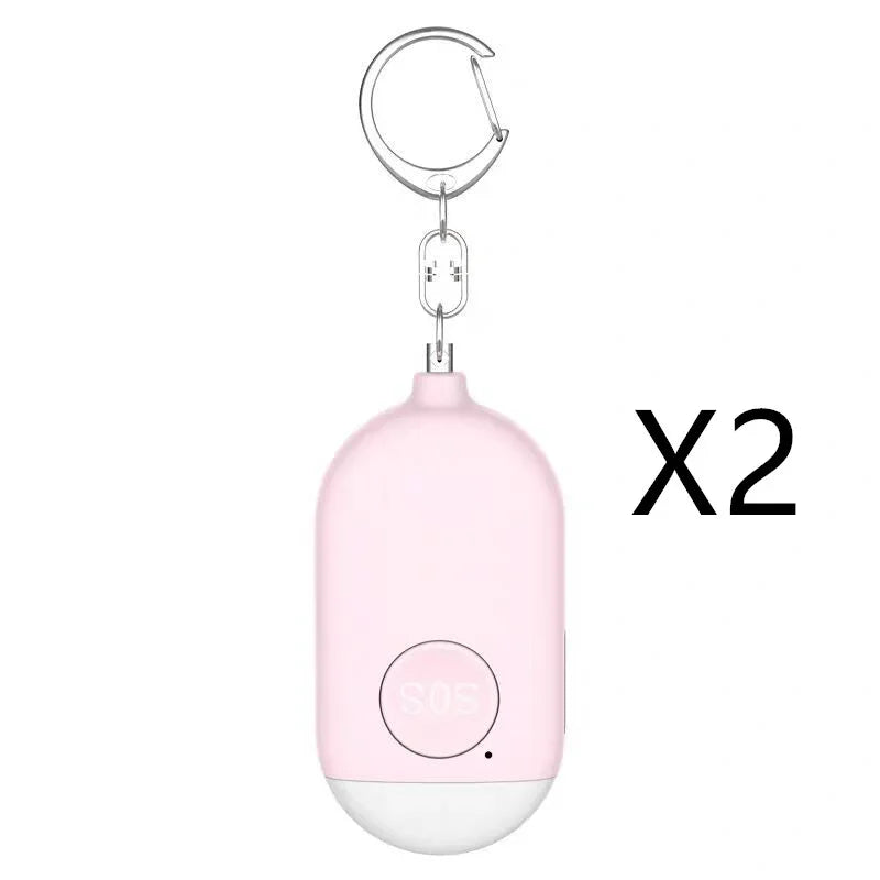 Pink keychain device with a white base on a white background, labeled 'X2'.