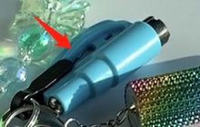 Blue window breaker with keychain attachment on a colorful background